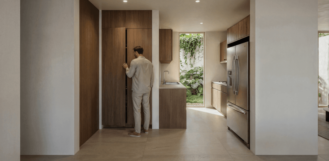 Render de la cocina integral con barra de granito de Encinas Residencial, San Mateo Atenco, Edo. Méx.